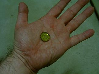 Logan's Run lifeclock crystal, yellow, on palm
